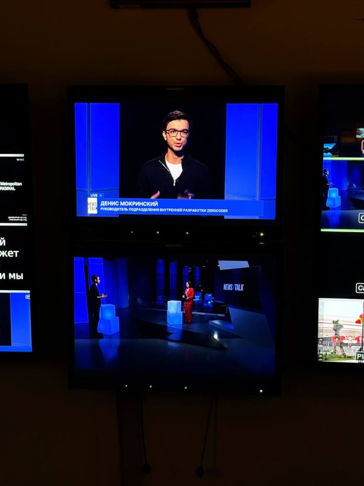Gallery monitors showing me on air with a name caption